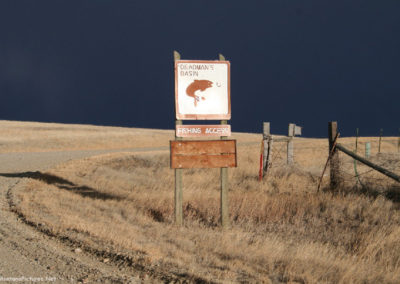 January picture of the Deadman’s Basin Reservoir Sign before a storm. Image is from the Ryegate Montana Picture Tour.