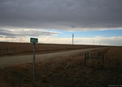 January picture of the Hilger Road Sign before a storm in Ryegate, Montana. Image is from the Ryegate Montana Picture Tour.