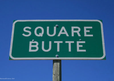 April picture of the Square Butte Montana sign on Highway 80. Image is from the Geraldine and Square Butte Montana Picture Tour.