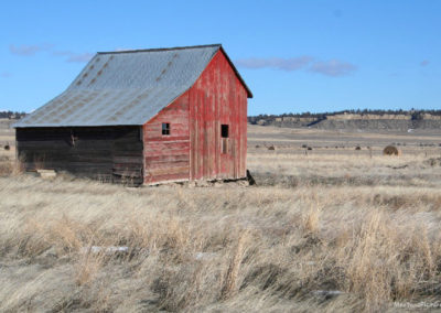 January picture of an abandoned red barn near Highway 300. Image is from the Ryegate Montana Picture Tour.